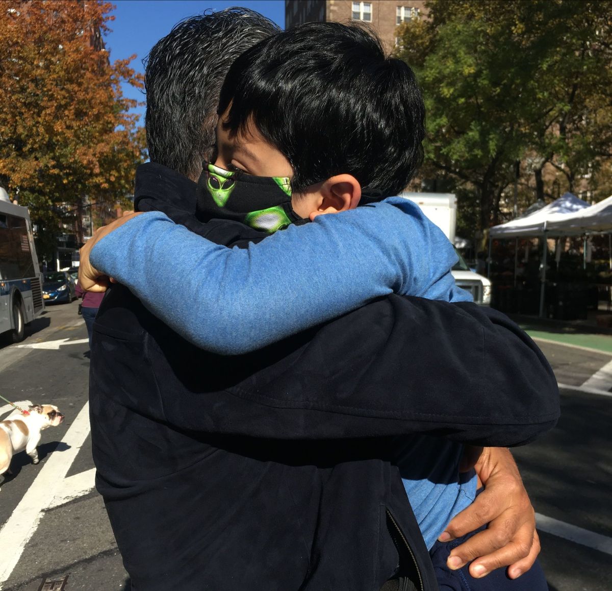 NFG President Adriana Rocha's husband, Ivan, holding their son, Emiliano, as they celebrated in the streets of Brooklyn after the 2020 elections