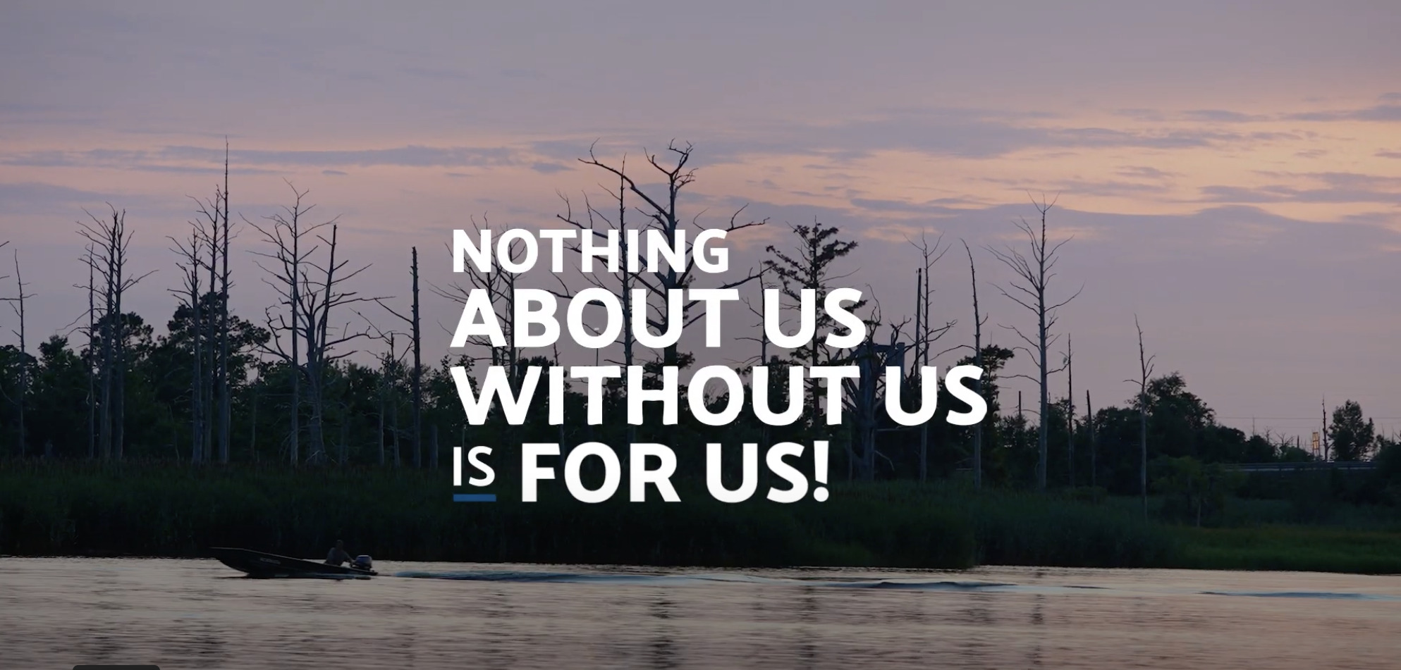 Photo of a lake with a boat at dusk. The title card says "Nothing About Us Without Us Is For Us"