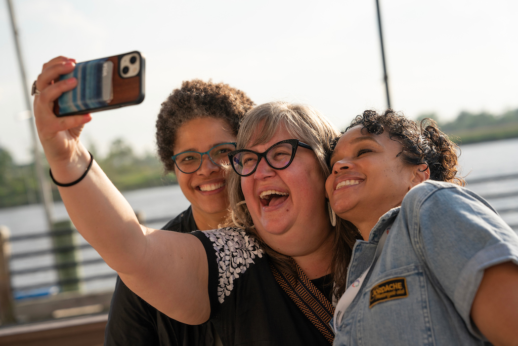 Photo of Amy Morris taking a selfie with Kellie Terry of North Star Fund and Helen Chin of Communities First Fund.