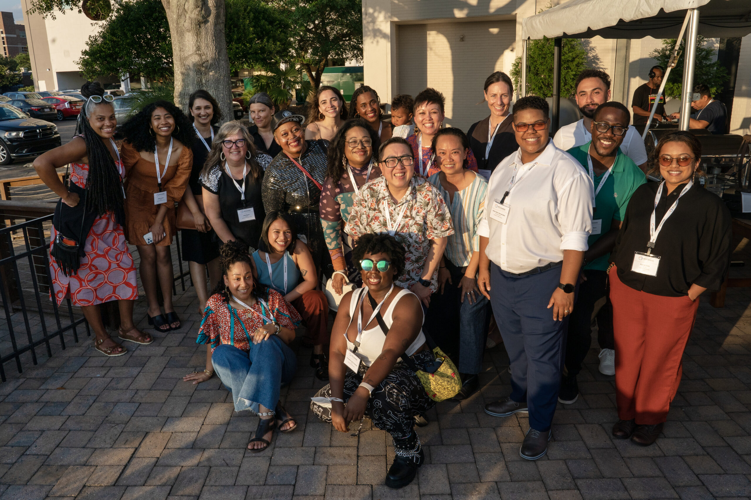 Teams from NFG and CHANGE Philanthropy pose together for a group photo on an outside terrace at the Hotel Ballast.